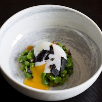 Slow-cooked egg with broad beans, garlic and Iberico ham dressing at aqua nueva