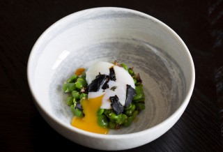 Slow-cooked egg with broad beans, garlic and Iberico ham dressing at aqua nueva